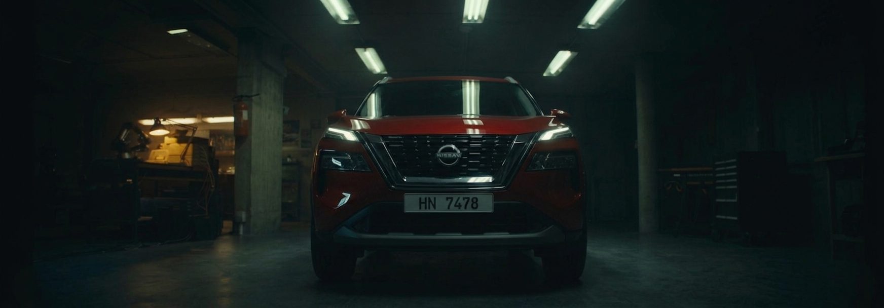 The Nissan Rogue Platinum waking in a dark garage
